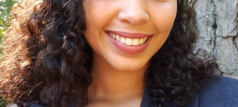 headshot photo of woman, outdoors