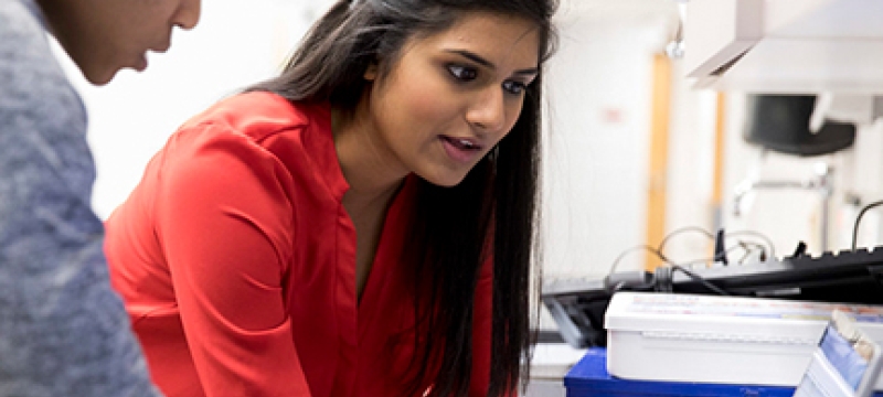 photo of two women with computer 