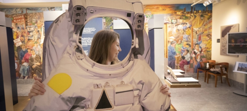 photo of woman with astronaut suit