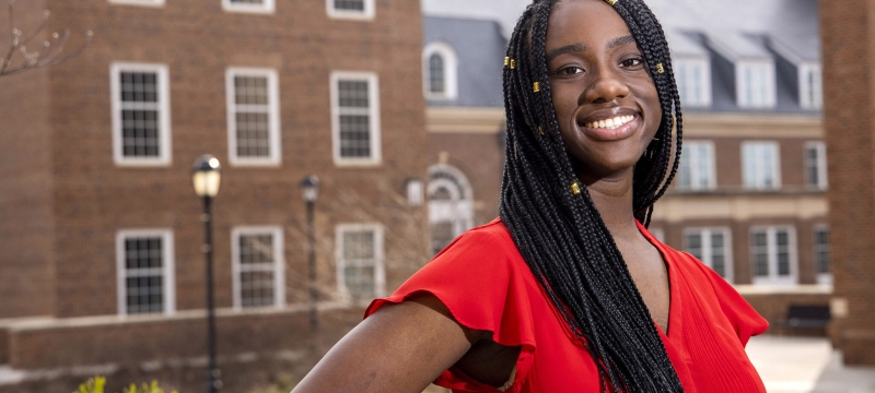 photo off woman outdoors, building in background