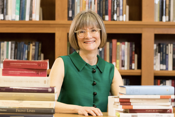 photo of woman with books