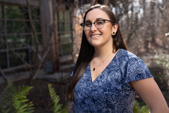 photo of woman outdoors, trees in background, day