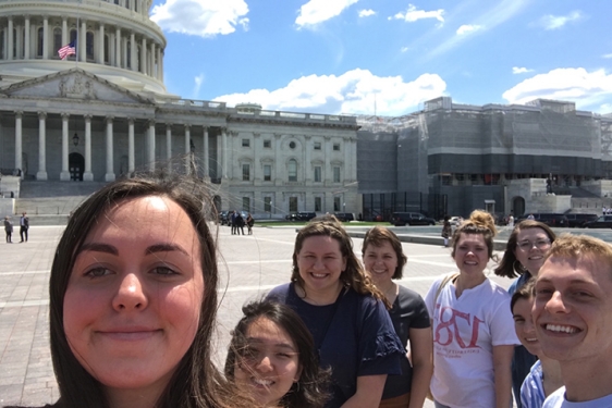 photo of eight students with US capitol building