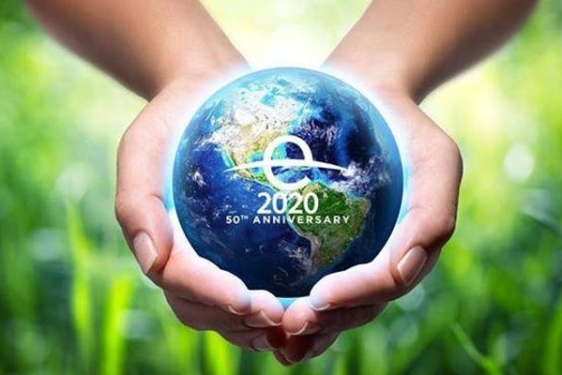 photo graphic of globe model in two hands