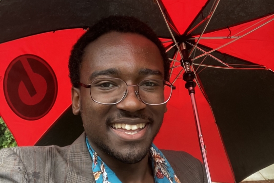 photo of man holding umbrella