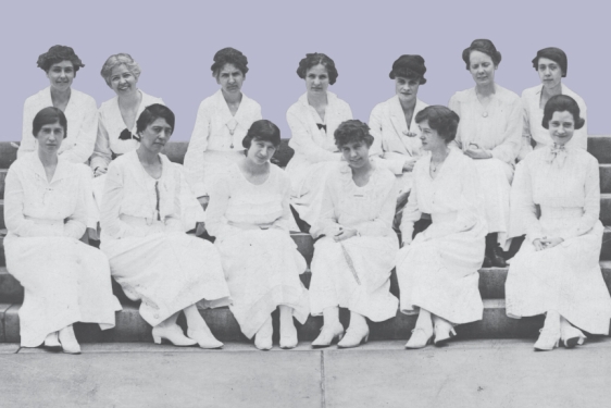 historical photo of women seated on steps