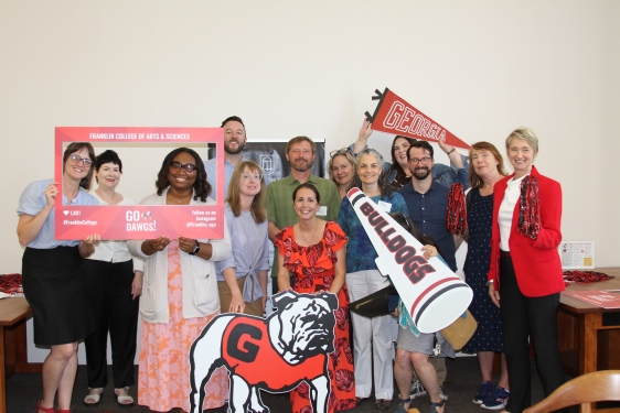 group photo of people holding banners with brnding