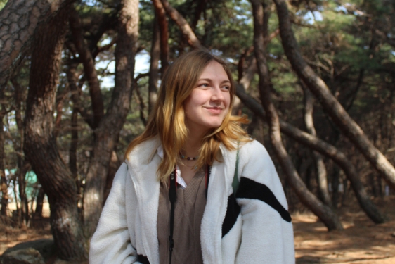 photo of woman, trees in background