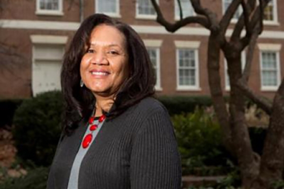 photo of woman with building background, day