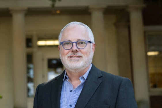 photo of man, building in background