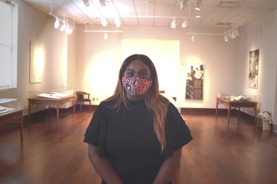 photo of woman with tables and light in background 