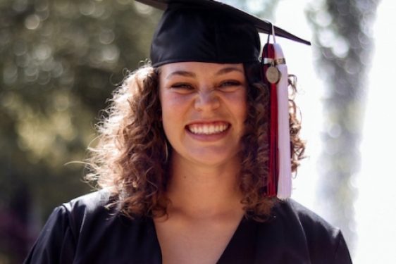 photo of woman in cap and gown