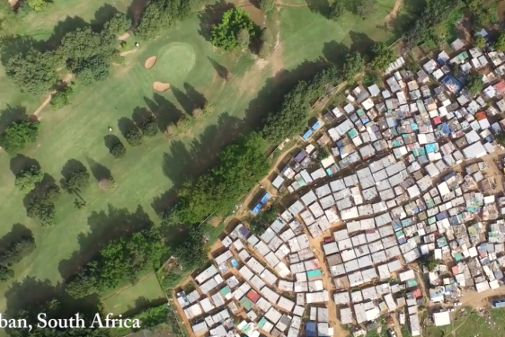 aerial photo of golf course contiguous to dense housing