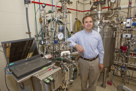 photo of man with fermentation equipment