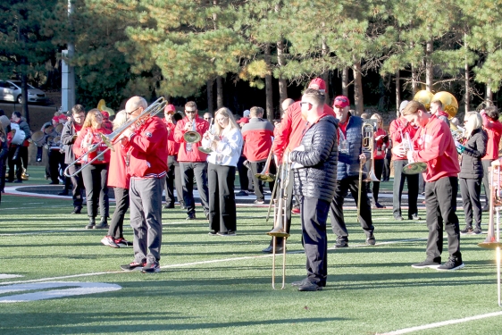 photo of people on field with band instruments