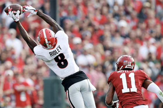 football player stretching for a catch