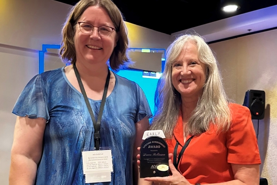 photo with two people, one with award