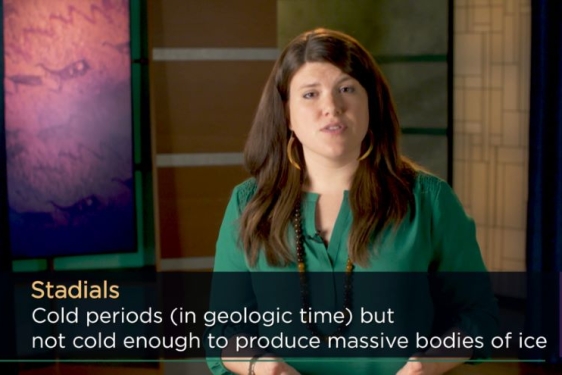 video still photo of woman in TV studio, with lower third graphic text