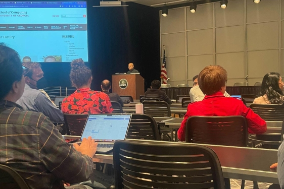 photo of conference and speaker at podium