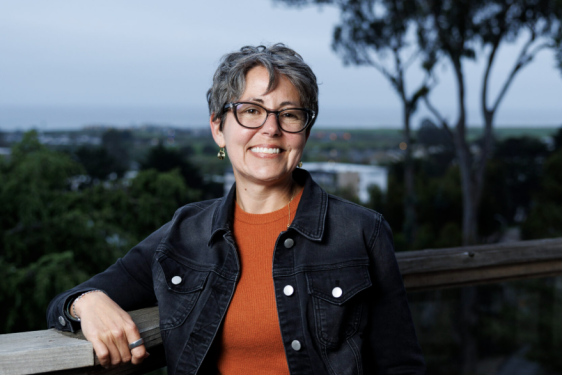 photo of woman, distance in background, day