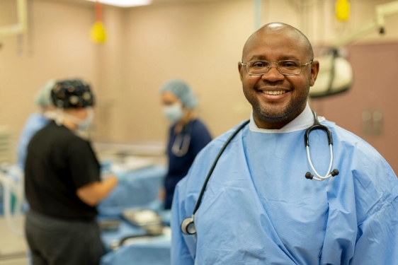 photo of man in scrubs with stethoscope