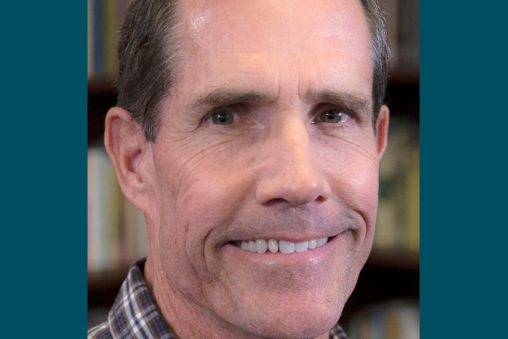 headshot photo of man, with graphic frame