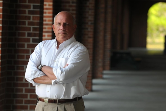 photo of man, corridor in background, day