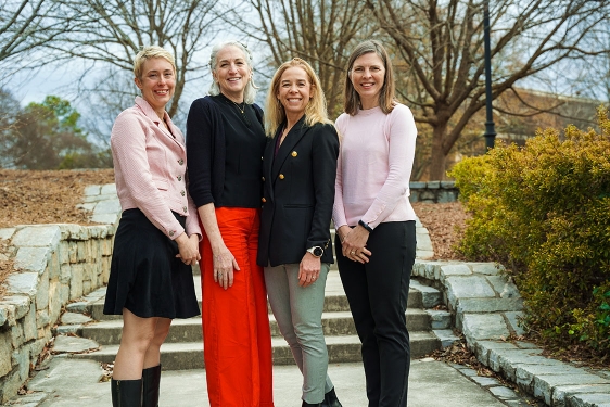photo of four women on walkway, day