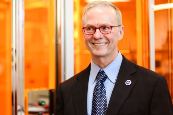photo of man next to clean room facility 