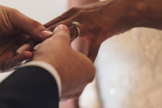 photo of hands with ring