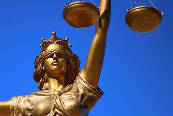 photo of statue of Lady Justice (Goddess), with blue sky