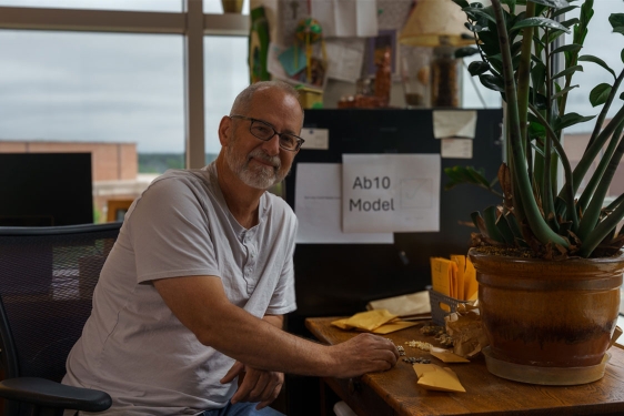 photo of man at desk with corn kernels