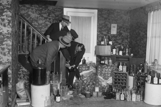 black and white archival image of alcohol hoarding