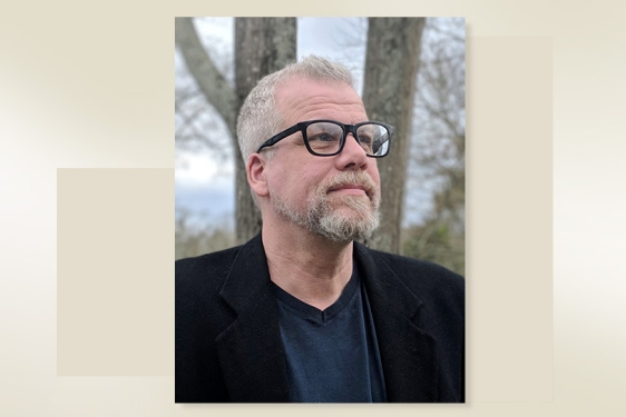 headshot of man, with color graphic block